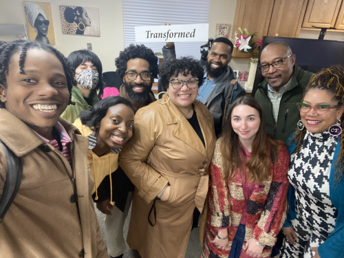 UCEF fellows and community advisors chat with Dr. Carmen Thomas, executive director of transformation GEMS, during the winter retreat (held at the organization's site).